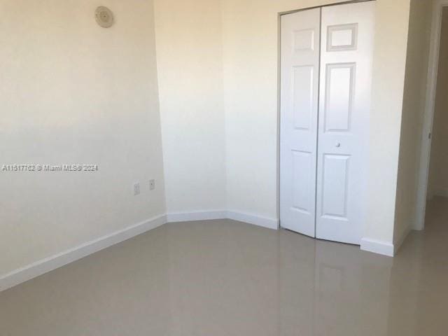 unfurnished bedroom featuring a closet