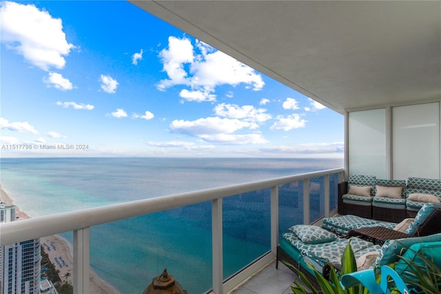 balcony featuring a water view