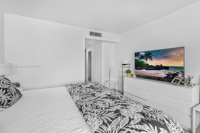 bedroom featuring a textured ceiling