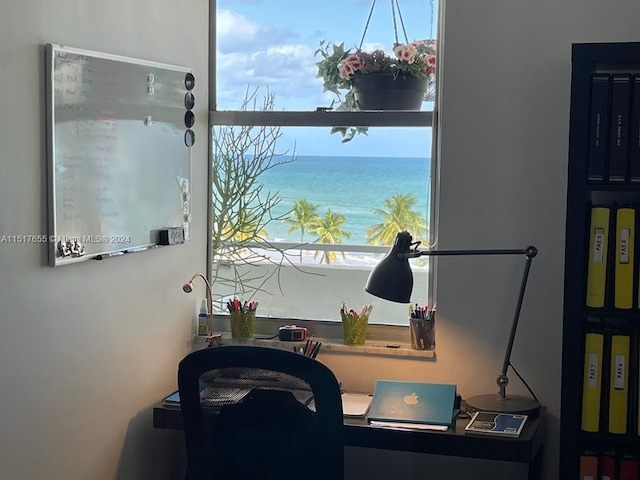 office area with plenty of natural light and a water view