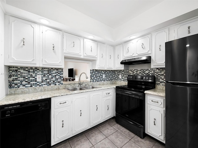 kitchen featuring white cabinets, backsplash, black appliances, and sink