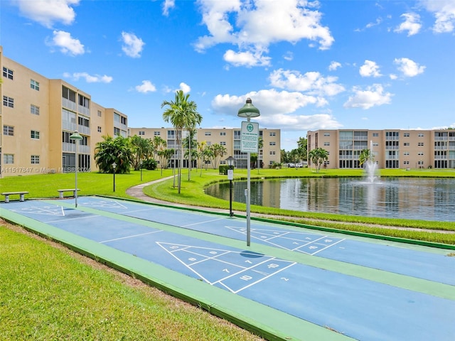 view of nearby features featuring a water view and a yard