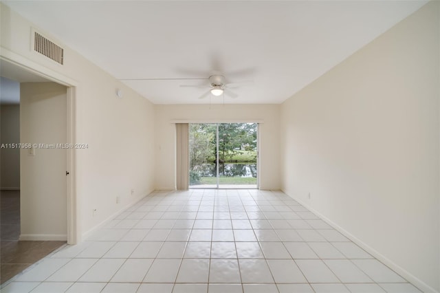 unfurnished room with light tile floors and ceiling fan