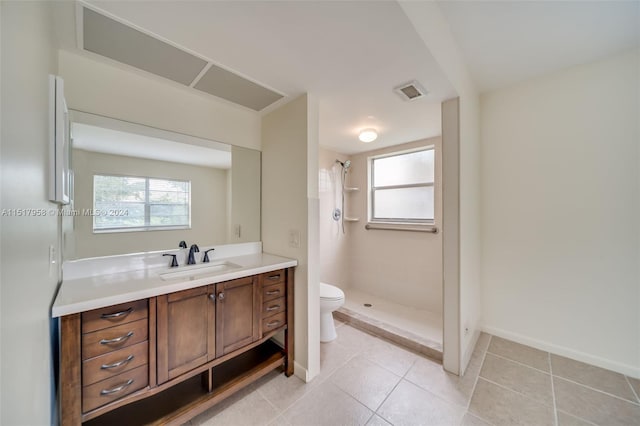 bathroom featuring tile floors, walk in shower, toilet, and vanity