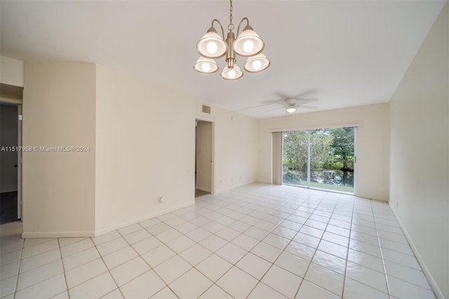 tiled empty room with ceiling fan with notable chandelier