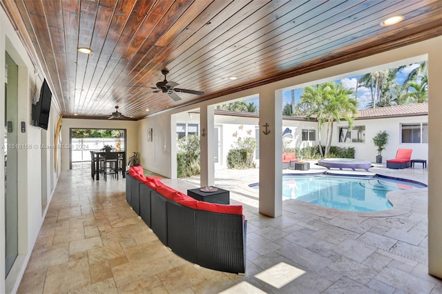 view of pool featuring ceiling fan