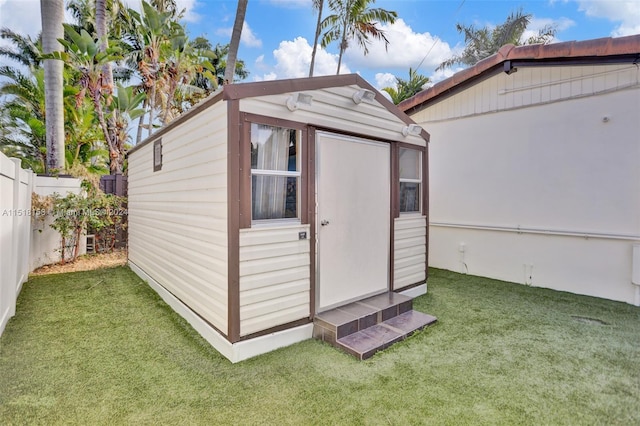 view of outdoor structure with a yard