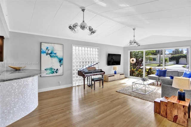 living room with a chandelier and light wood-type flooring