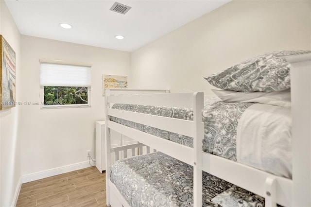 bedroom with light hardwood / wood-style flooring