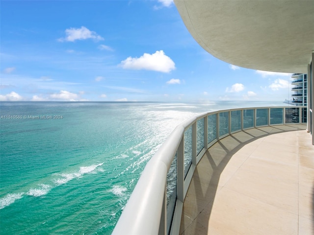 balcony featuring a water view