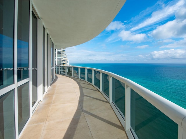 balcony featuring a water view