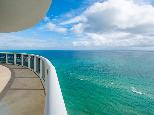 balcony featuring a water view