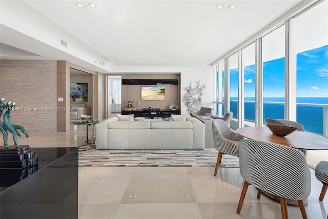 tiled living room with a water view