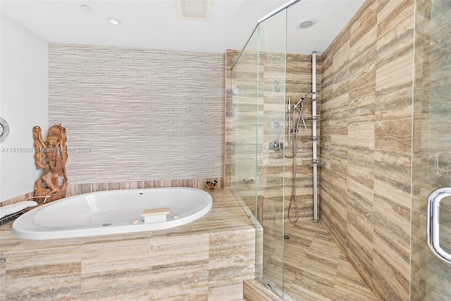 bathroom featuring plus walk in shower