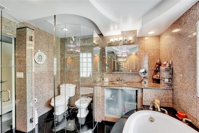 full bathroom featuring tile walls and a bidet