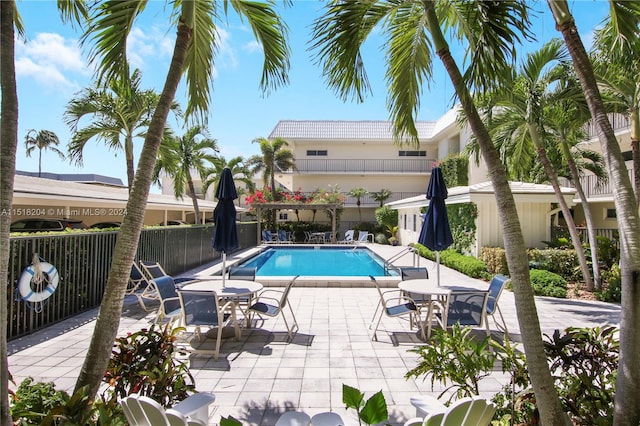 view of swimming pool featuring a patio area