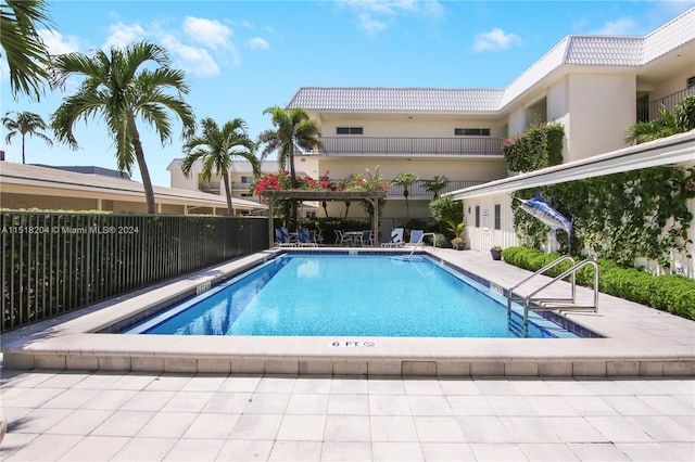 view of swimming pool with a patio