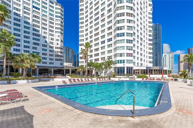 view of swimming pool featuring a patio