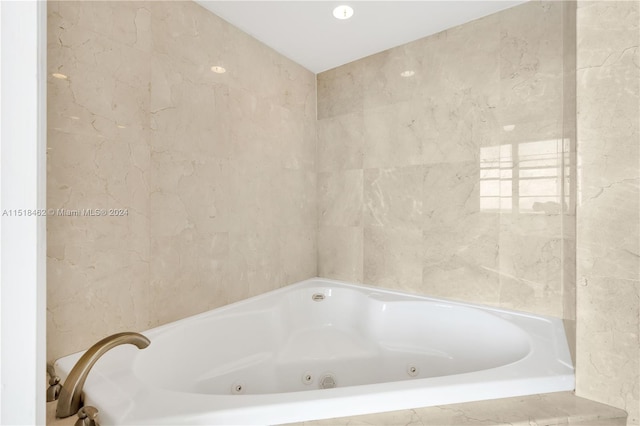 bathroom with tiled bath