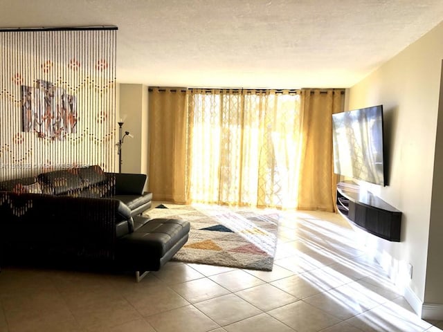 tiled living room with a textured ceiling