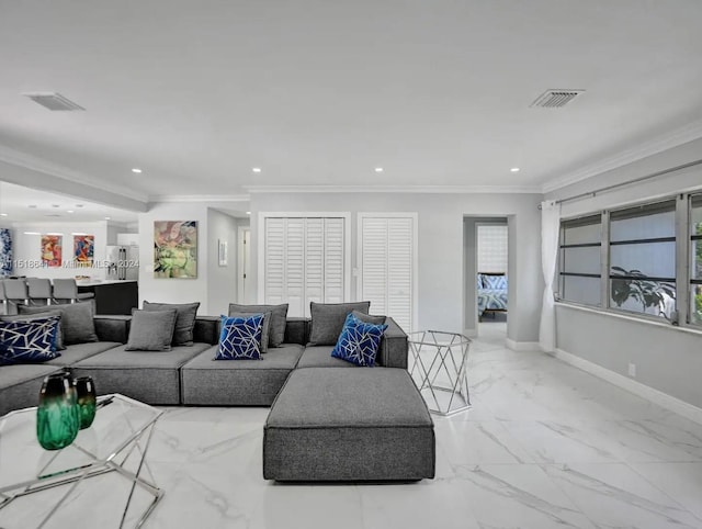 living room with ornamental molding and light tile floors