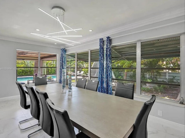 dining space featuring light tile floors, a notable chandelier, and crown molding