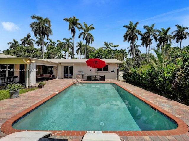 view of swimming pool featuring a patio area