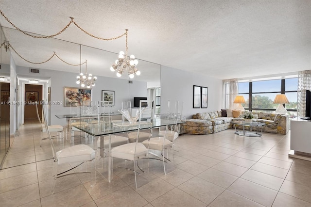 tiled dining room with a textured ceiling and a notable chandelier