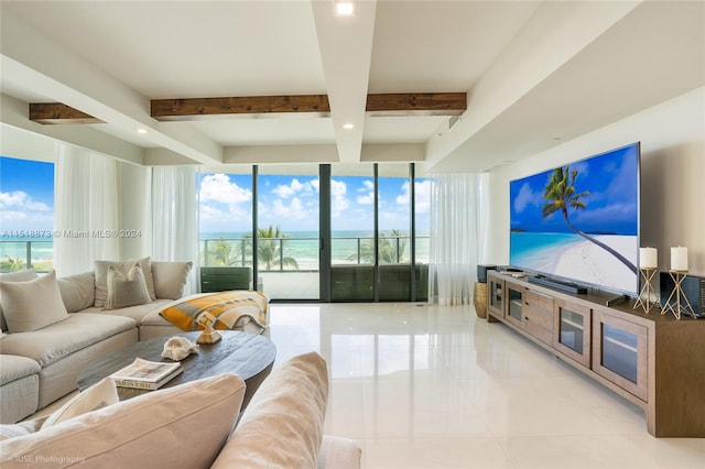 tiled living room with plenty of natural light, beam ceiling, and a water view