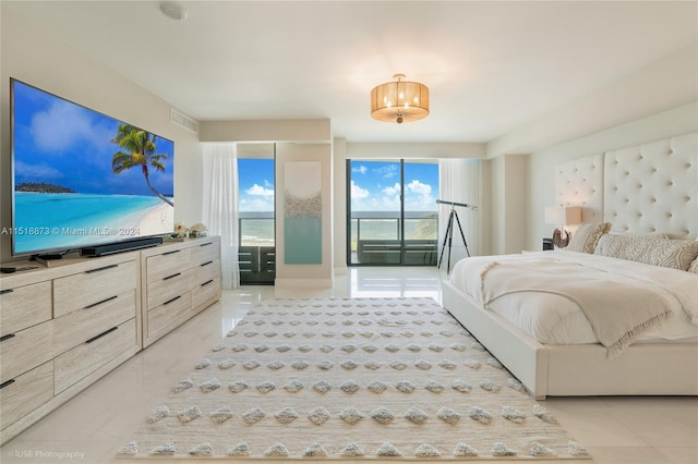 tiled bedroom featuring access to exterior