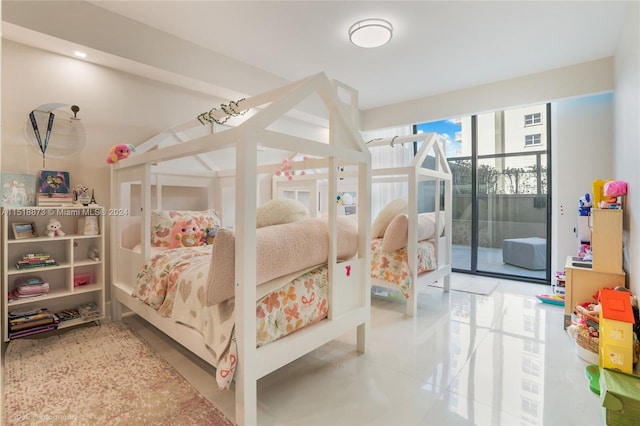 bedroom featuring light tile flooring and access to outside