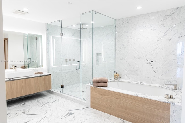 bathroom featuring independent shower and bath and vanity