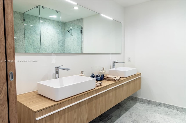 bathroom featuring vanity and a shower with shower door