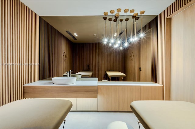 interior space with sink and wooden walls