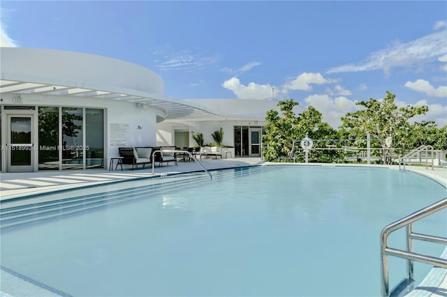 view of pool featuring a patio area