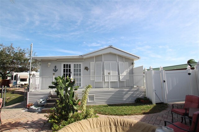 back of property featuring a patio