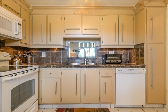 kitchen featuring sink, white appliances, light tile patterned flooring, and decorative backsplash