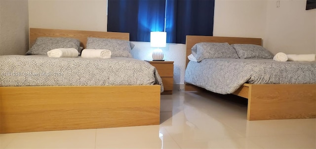 bedroom featuring tile flooring