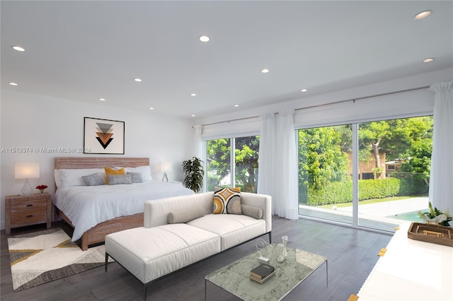 bedroom featuring access to outside and hardwood / wood-style flooring