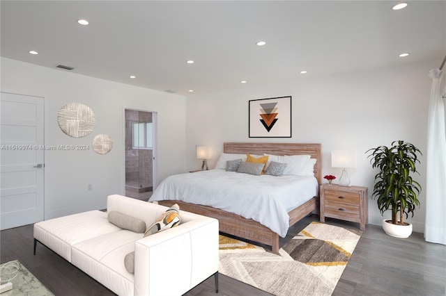 bedroom with dark hardwood / wood-style flooring