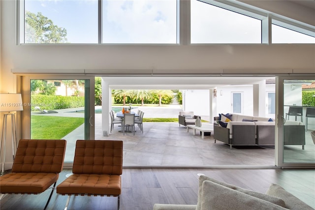 interior space with a high ceiling and light wood-type flooring