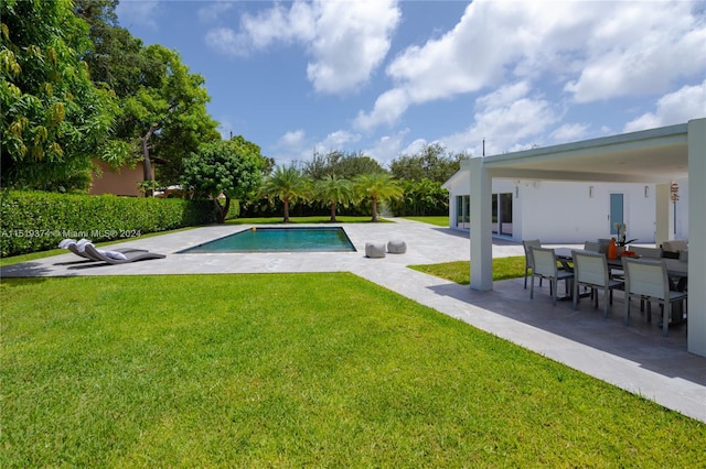 view of pool featuring a yard and a patio area