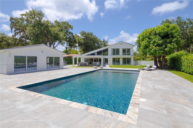 view of swimming pool featuring a patio