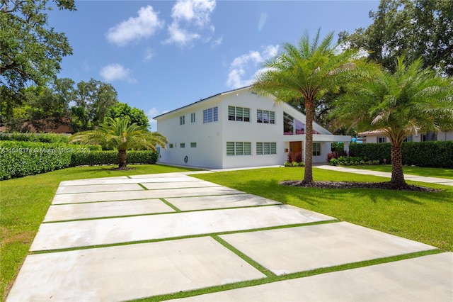 view of front of property with a front lawn