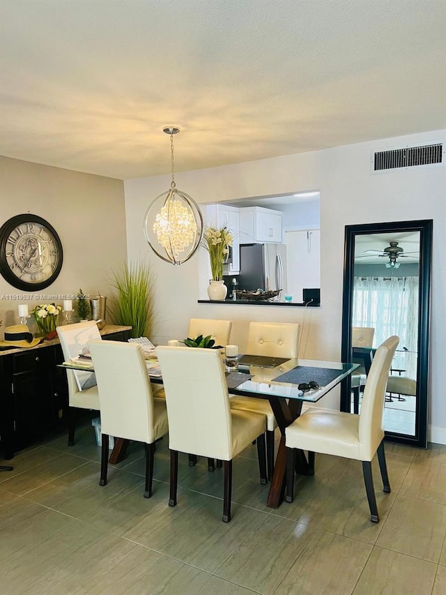 dining area with a notable chandelier