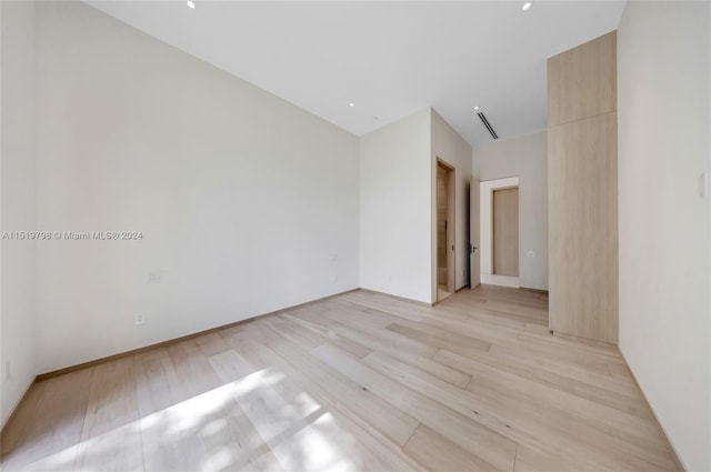 unfurnished room featuring light wood-type flooring