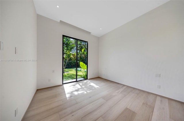 empty room featuring recessed lighting and light wood finished floors