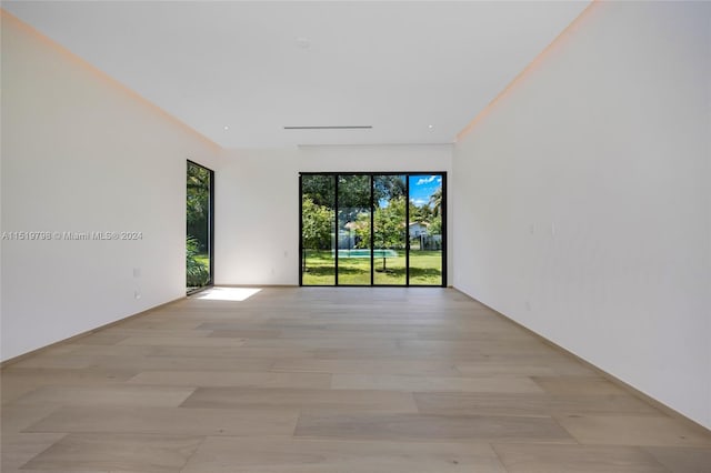 unfurnished room featuring light wood-style flooring