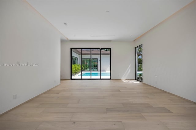 empty room with light wood finished floors