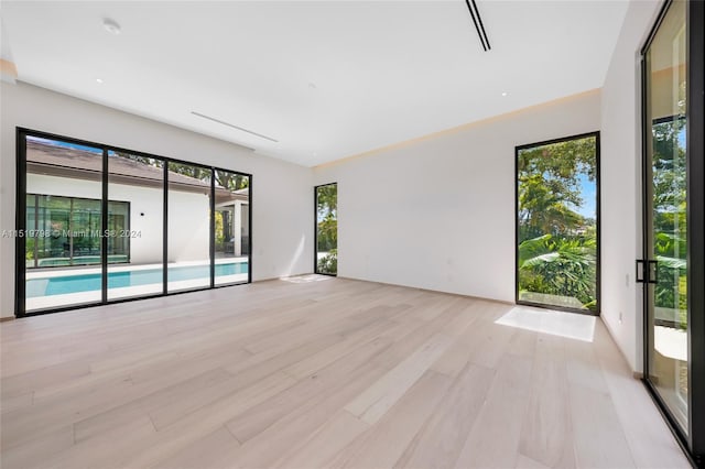 unfurnished room featuring light wood finished floors